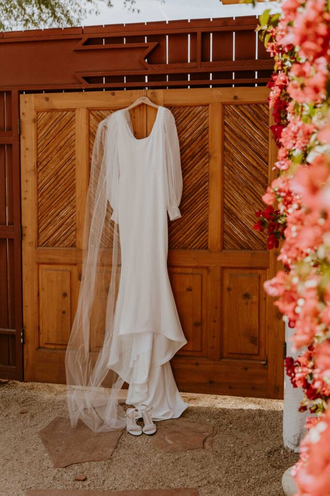 Photo of the bride's dress hanging — Desert Wedding Photography by Mattie O'Neill