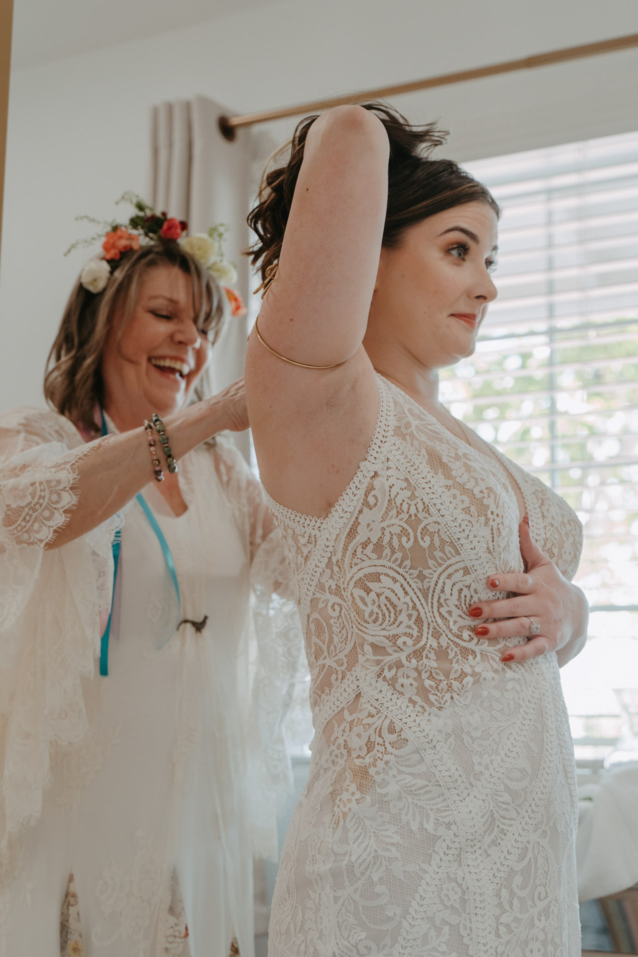 Mother of the bride helping her put her dress on — Joshua Tree Wedding Photographer 