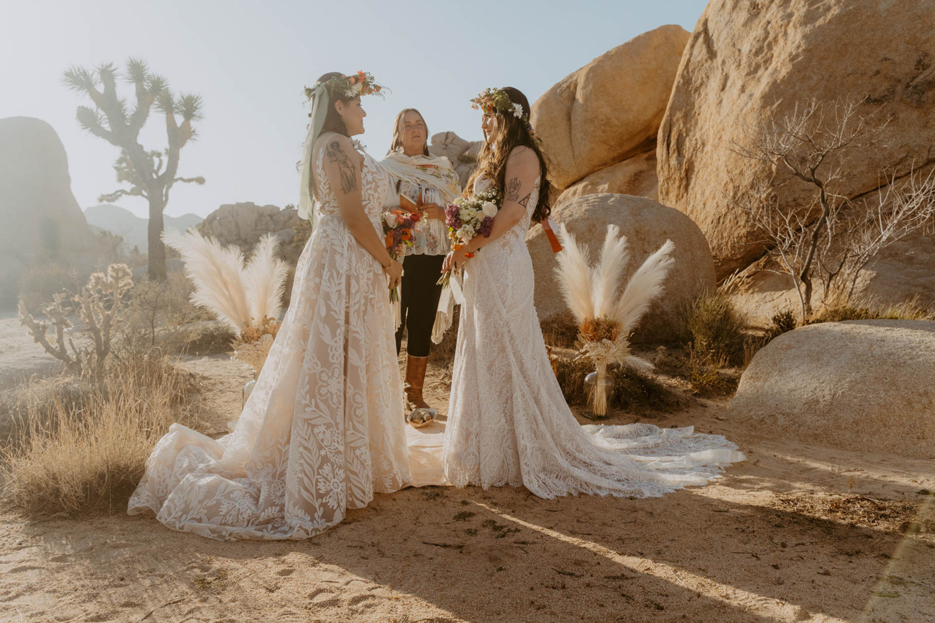 The brides standing in front of their officiant — Joshua Tree Wedding Photographer