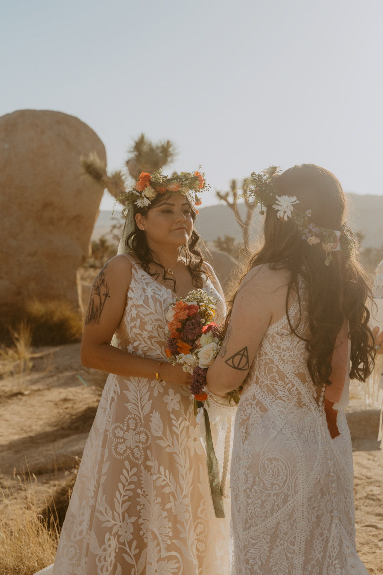 Close-up shot of the brides The brides during their ceremony in Hidden Valley — Joshua Tree Wedding Photographer