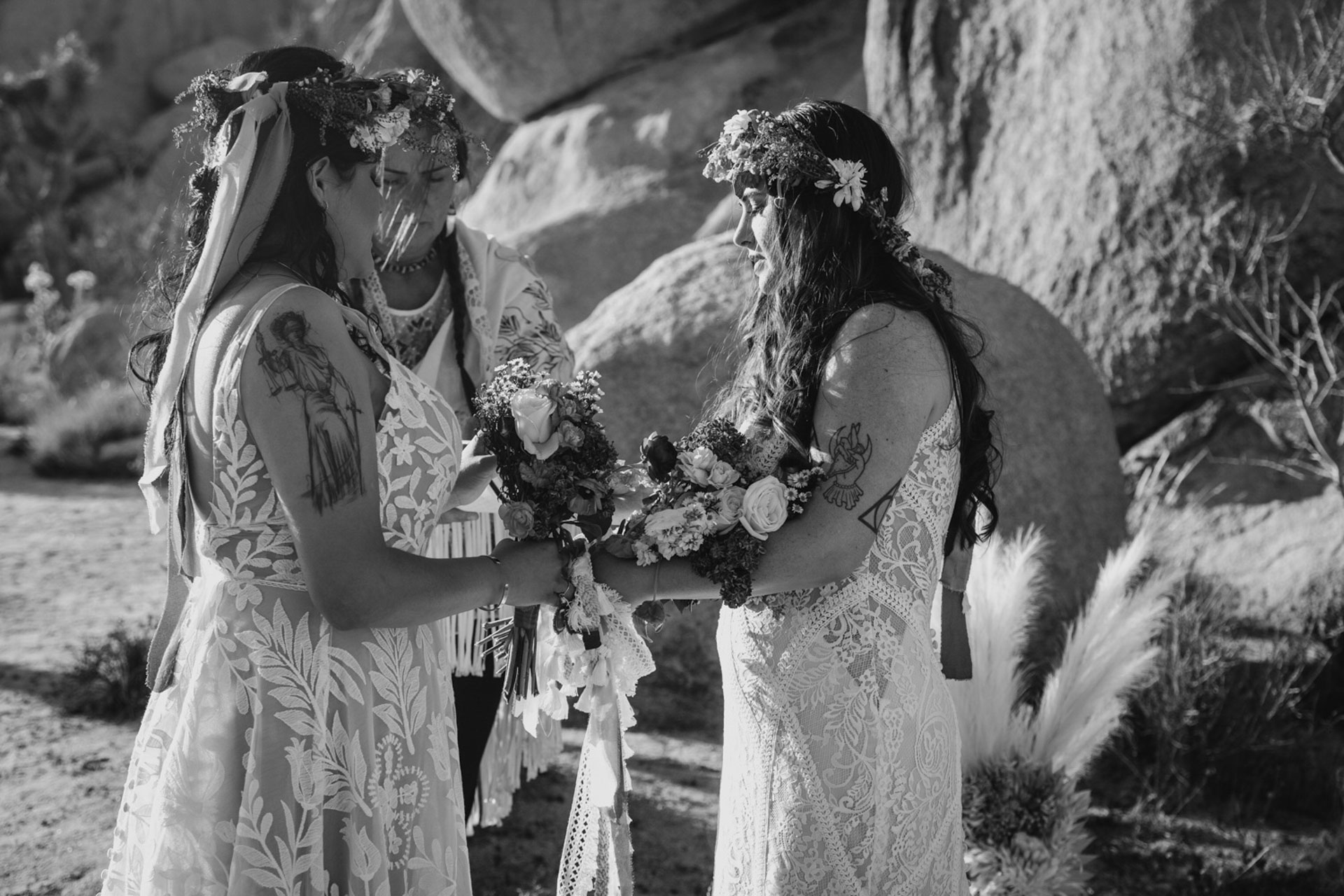 Black and white photo of the brides bouquets during their ceremony — Joshua Tree Wedding Photographer