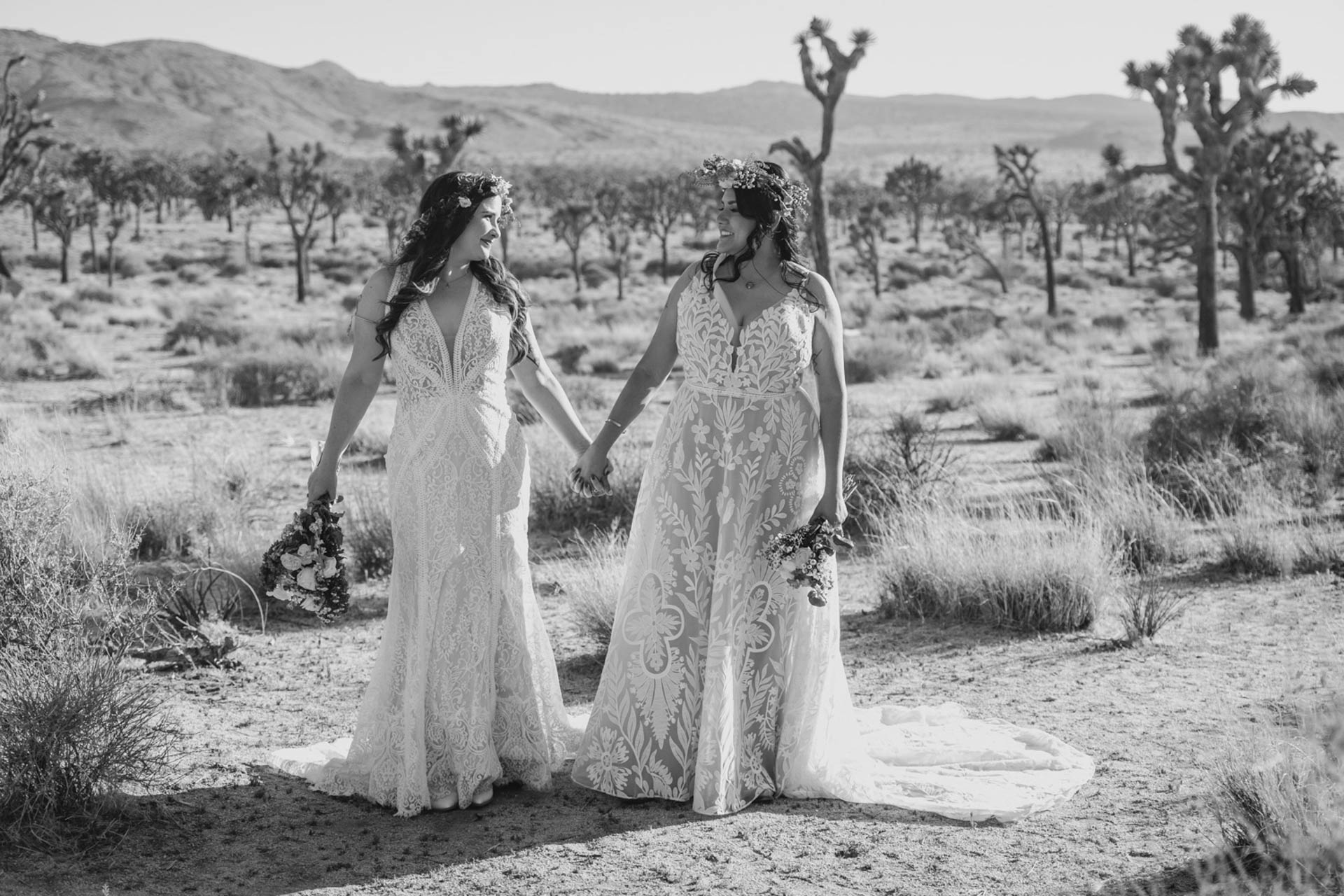 Black and white photo of brides holding hands — Joshua Tree Wedding Photographer