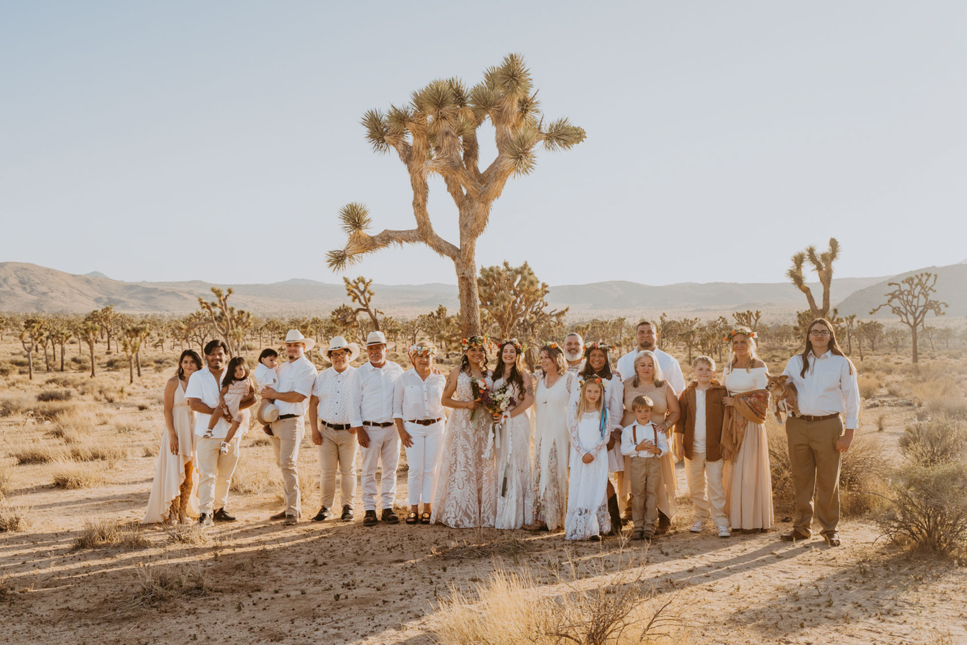 Family of the newlyweds smiling in all white — Joshua Tree Wedding Photographer